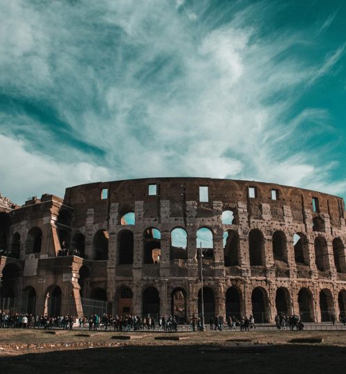 Stunning view of the Colosseum in Rome showcasing its ancient architecture and historic grandeur.